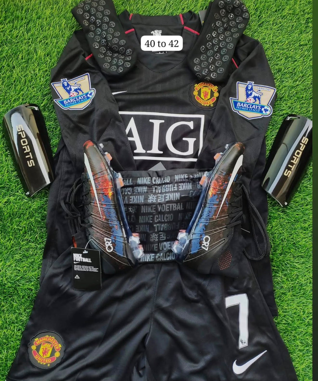 CR7 black retro jersey football boots and matching football essentials displayed on turf